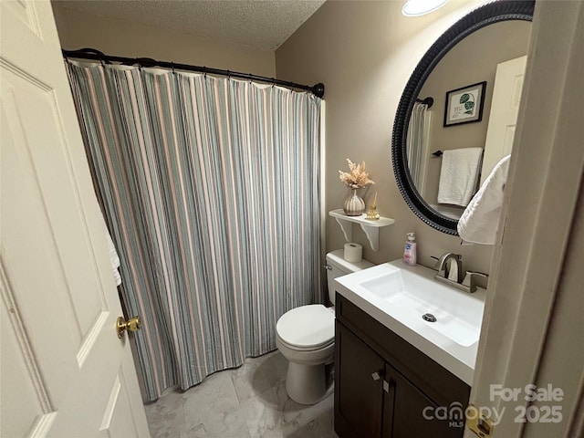 full bathroom featuring toilet, vanity, a textured ceiling, marble look tiles, and a shower with curtain