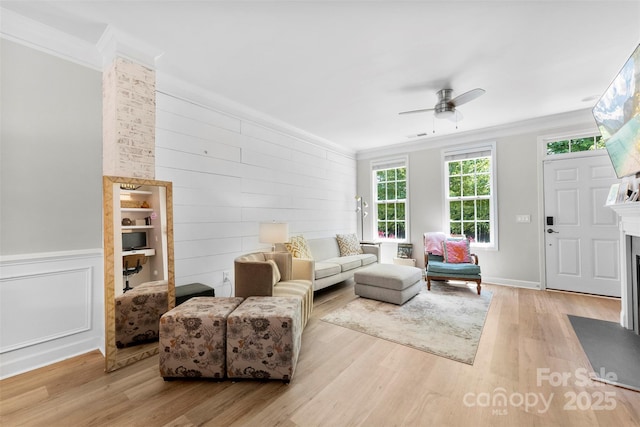 2485 Shanklin Ln, Denver, NC 28037 - living area with a fireplace with flush hearth, crown molding, wood finished floors, and ceiling fan