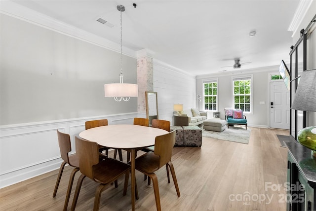 2485 Shanklin Ln, Denver, NC 28037 - dining space with crown molding, light wood finished floors, and ceiling fan