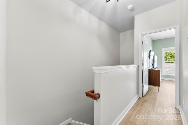2485 Shanklin Ln, Denver, NC 28037 - corridor with an upstairs landing, wood finished floors, and baseboards