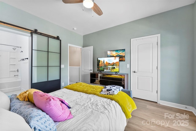 2485 Shanklin Ln, Denver, NC 28037 - bedroom featuring light wood-style flooring, baseboards, and a ceiling fan