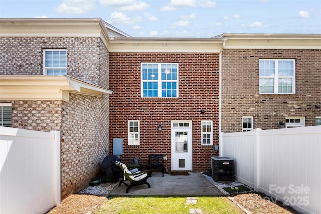 2485 Shanklin Ln, Denver, NC 28037 - back of property featuring fence, central AC unit, a patio, and brick siding