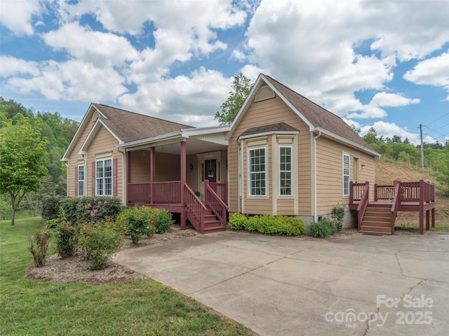 2600 Crabtree Rd, Waynesville, NC 28785 - view of front of house with a porch, stairs, and roof with shingles