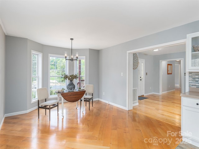 2600 Crabtree Rd, Waynesville, NC 28785 - dining room with a chandelier, baseboards, and light wood finished floors