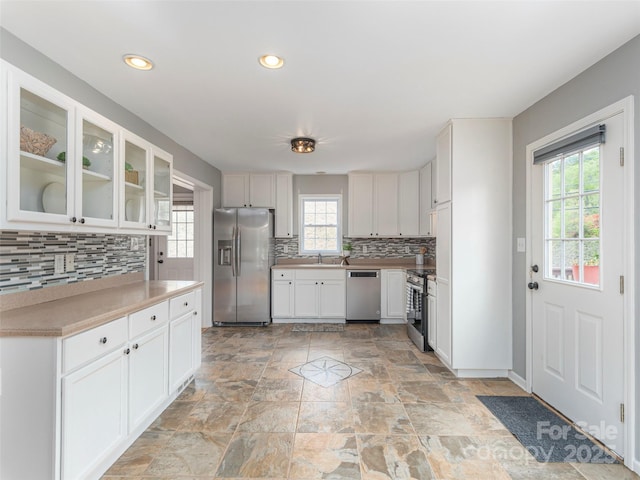 2600 Crabtree Rd, Waynesville, NC 28785 - kitchen featuring stainless steel appliances, backsplash, white cabinetry, and recessed lighting