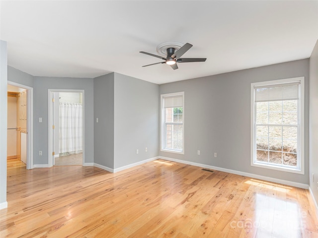 2600 Crabtree Rd, Waynesville, NC 28785 - empty room with baseboards, a ceiling fan, and light wood-style flooring