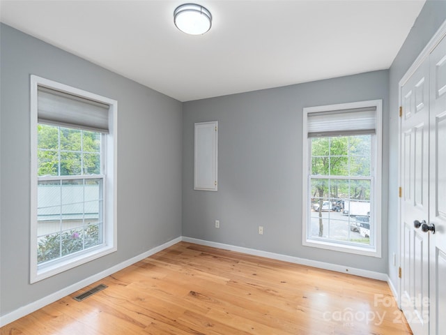 2600 Crabtree Rd, Waynesville, NC 28785 - unfurnished room featuring baseboards, healthy amount of natural light, and light wood-style floors