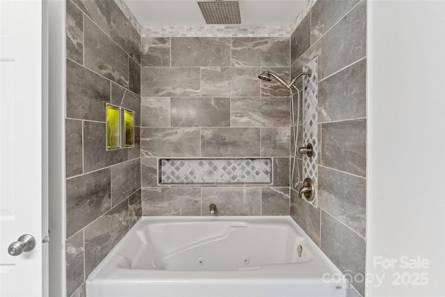 bathroom featuring a combined bath / shower with rainfall shower
