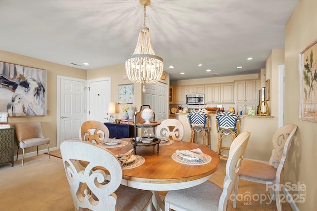 143 Wildflower Ln, Sugar Mountain, NC 28604 - dining space with a chandelier, baseboards, and recessed lighting