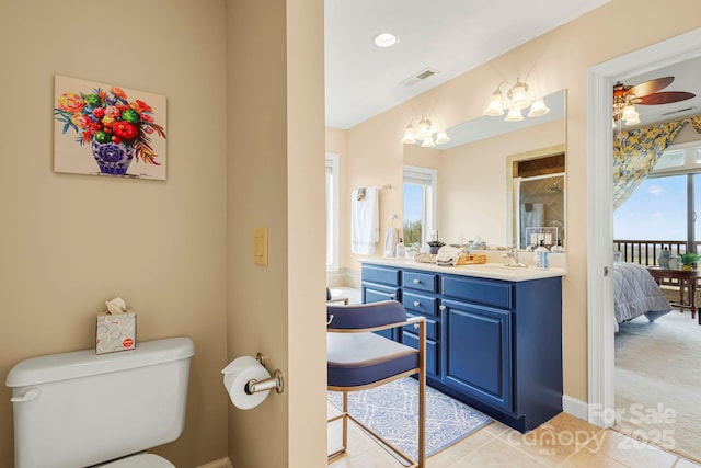 143 Wildflower Ln, Sugar Mountain, NC 28604 - ensuite bathroom featuring toilet, vanity, a ceiling fan, a shower, and tile patterned floors