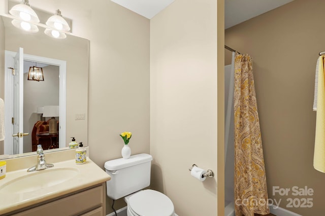 143 Wildflower Ln, Sugar Mountain, NC 28604 - bathroom with vanity, toilet, and curtained shower