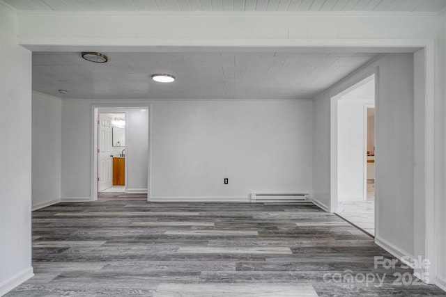 3614 Frank Whisnant Rd, Morganton, NC 28655 - unfurnished room with baseboard heating, wood finished floors, and baseboards