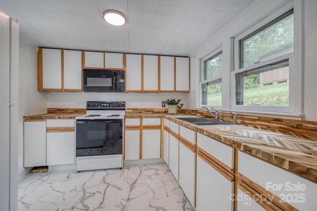 3614 Frank Whisnant Rd, Morganton, NC 28655 - kitchen with black microwave, electric range oven, a sink, light marble finish floors, and white cabinets