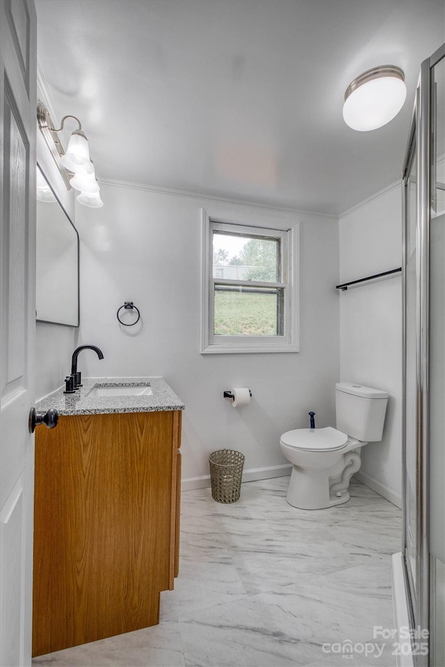 3614 Frank Whisnant Rd, Morganton, NC 28655 - bathroom with baseboards, toilet, an enclosed shower, vanity, and ornamental molding