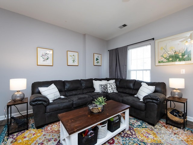 living room with baseboards and light wood finished floors