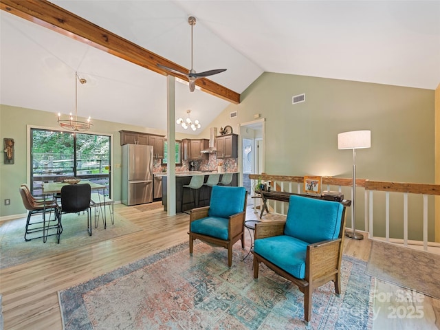 76 Shirley Dr, Maggie Valley, NC 28751 - living area with a chandelier, light wood-type flooring, ceiling fan, baseboards, and high vaulted ceiling
