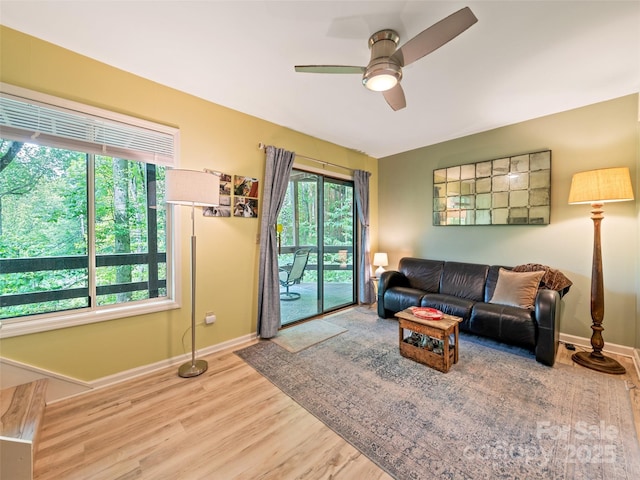 76 Shirley Dr, Maggie Valley, NC 28751 - living room featuring baseboards, wood finished floors, and a ceiling fan