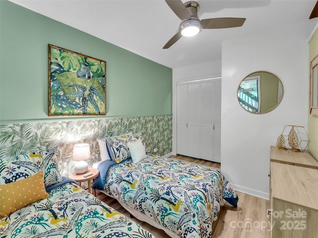 76 Shirley Dr, Maggie Valley, NC 28751 - bedroom featuring wood finished floors, a closet, ceiling fan, and baseboards