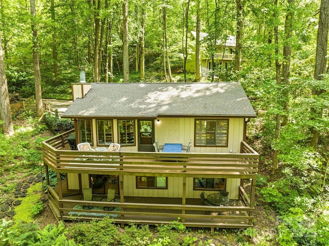76 Shirley Dr, Maggie Valley, NC 28751 - view of front of property with roof with shingles, a wooden deck, a chimney, and a wooded view