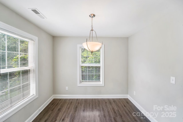 668 Smith St, Kannapolis, NC 28083 - empty room featuring dark wood-type flooring and baseboards