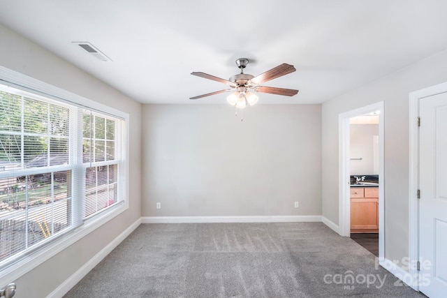 668 Smith St, Kannapolis, NC 28083 - carpeted spare room featuring ceiling fan and baseboards