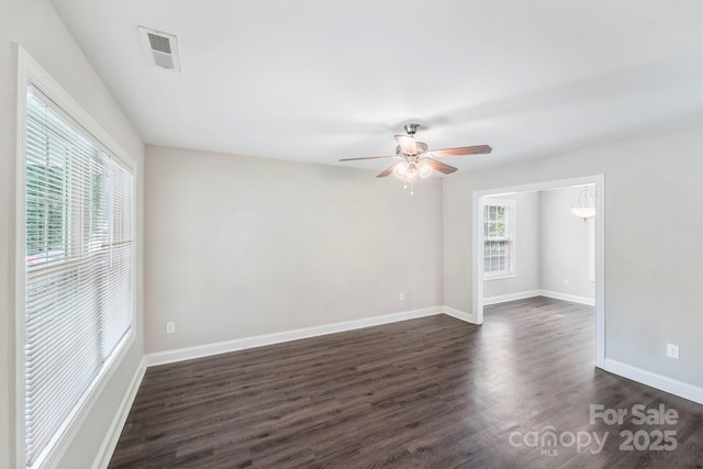 668 Smith St, Kannapolis, NC 28083 - spare room with dark wood finished floors, a ceiling fan, and baseboards