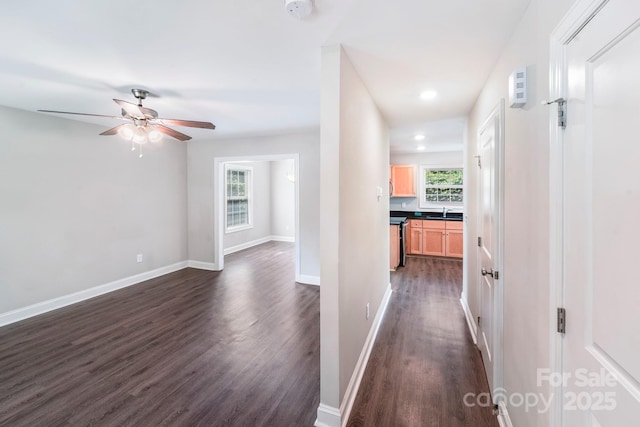 668 Smith St, Kannapolis, NC 28083 - hallway with dark wood finished floors, healthy amount of natural light, baseboards, and recessed lighting