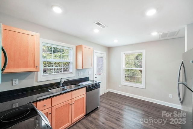 668 Smith St, Kannapolis, NC 28083 - kitchen featuring appliances with stainless steel finishes, a sink, healthy amount of natural light, dark wood-type flooring, and recessed lighting