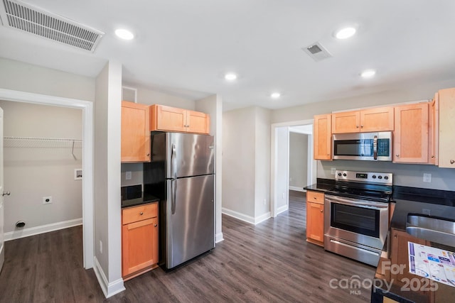 668 Smith St, Kannapolis, NC 28083 - kitchen with appliances with stainless steel finishes, dark countertops, baseboards, dark wood-type flooring, and light brown cabinets