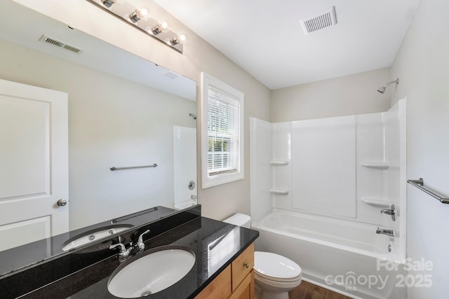 668 Smith St, Kannapolis, NC 28083 - full bath with toilet, shower / washtub combination, vanity, and wood finished floors
