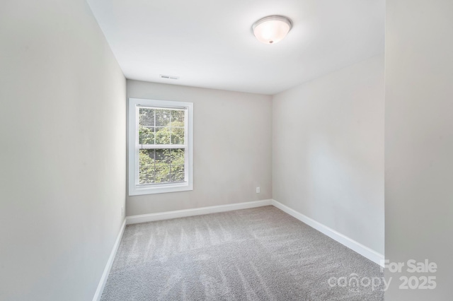 668 Smith St, Kannapolis, NC 28083 - carpeted spare room featuring baseboards