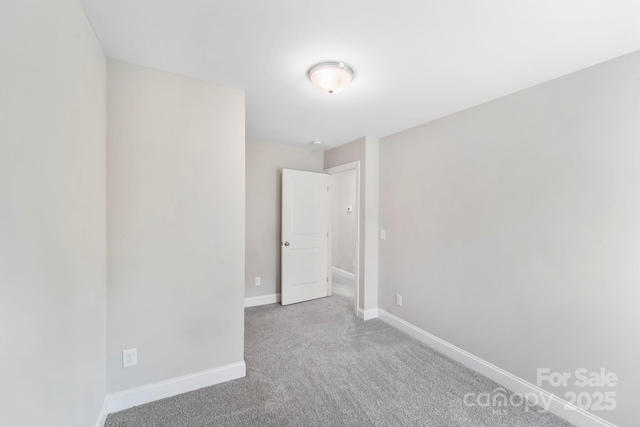 668 Smith St, Kannapolis, NC 28083 - carpeted empty room featuring baseboards
