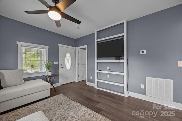 11 Mountain View Anx, Old Fort, NC 28762 - living area with wood finished floors, baseboards, ceiling fan, and built in features