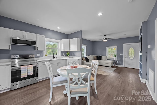 11 Mountain View Anx, Old Fort, NC 28762 - kitchen featuring appliances with stainless steel finishes, light countertops, white cabinetry, a sink, and open floor plan
