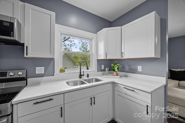 11 Mountain View Anx, Old Fort, NC 28762 - kitchen with a sink, stainless steel appliances, light countertops, and white cabinets