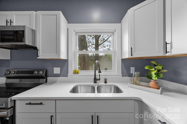 11 Mountain View Anx, Old Fort, NC 28762 - kitchen featuring appliances with stainless steel finishes, a sink, light countertops, and white cabinets