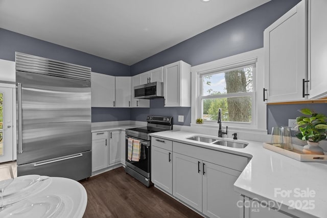 11 Mountain View Anx, Old Fort, NC 28762 - kitchen featuring appliances with stainless steel finishes, a sink, light countertops, and white cabinets
