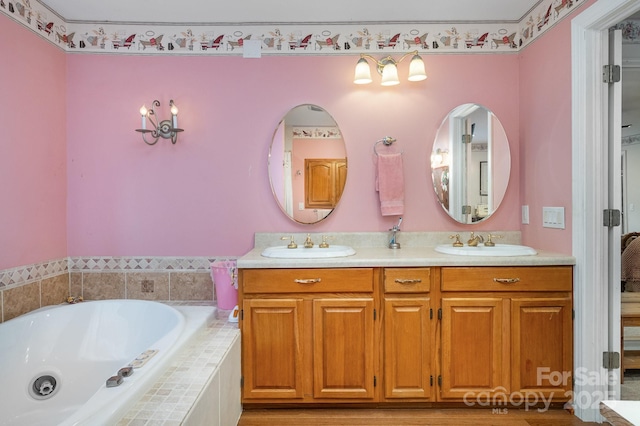 907 Sikes Mill Rd, Monroe, NC 28110 - full bathroom with double vanity and a bath