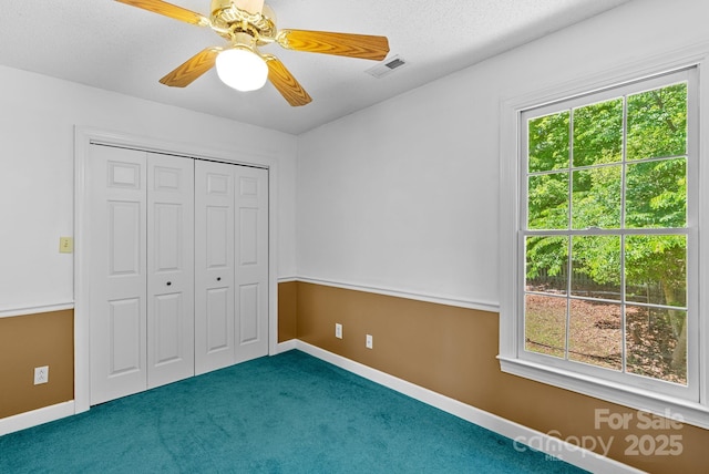 304 La Foret Dr, Morganton, NC 28655 - unfurnished bedroom with carpet floors, a closet, a ceiling fan, and baseboards