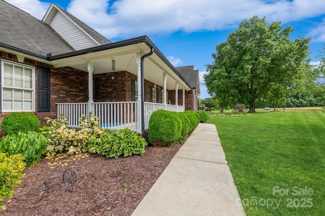 8520 Wright Rd, Kannapolis, NC 28081 - view of property exterior featuring brick siding, a lawn, a porch, and roof with shingles