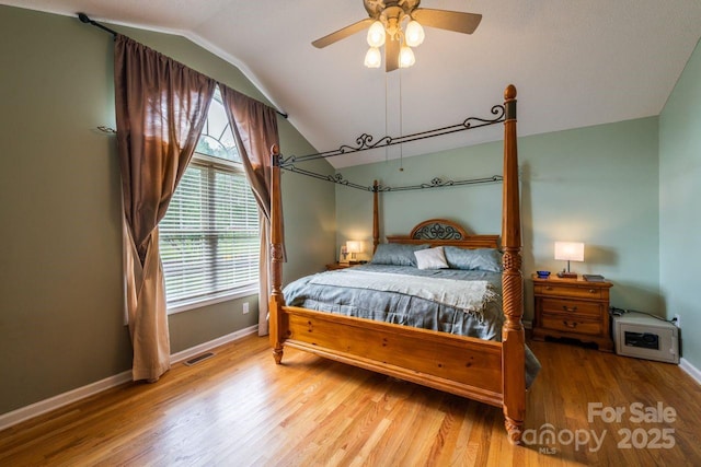 8520 Wright Rd, Kannapolis, NC 28081 - bedroom featuring lofted ceiling, baseboards, wood finished floors, and ceiling fan