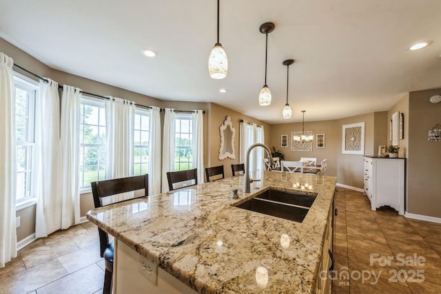 8520 Wright Rd, Kannapolis, NC 28081 - kitchen featuring a sink, light tile patterned floors, baseboards, a chandelier, and recessed lighting