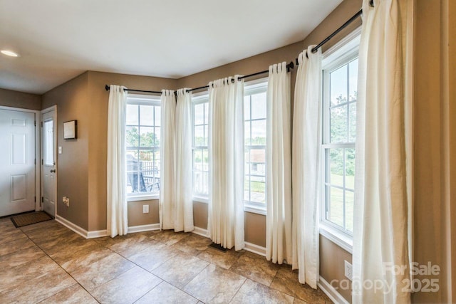 8520 Wright Rd, Kannapolis, NC 28081 - entryway with plenty of natural light, baseboards, and light tile patterned flooring