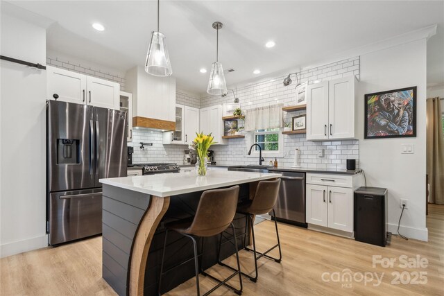 324 Elm St, Belmont, NC 28012 - kitchen featuring appliances with stainless steel finishes, open shelves, decorative backsplash, white cabinets, and recessed lighting
