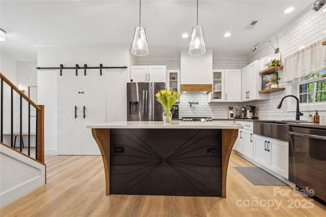 324 Elm St, Belmont, NC 28012 - kitchen with stainless steel appliances, a sink, light wood-type flooring, decorative backsplash, and recessed lighting
