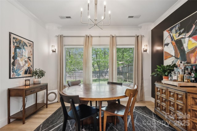 324 Elm St, Belmont, NC 28012 - dining space featuring light wood-type flooring and a chandelier