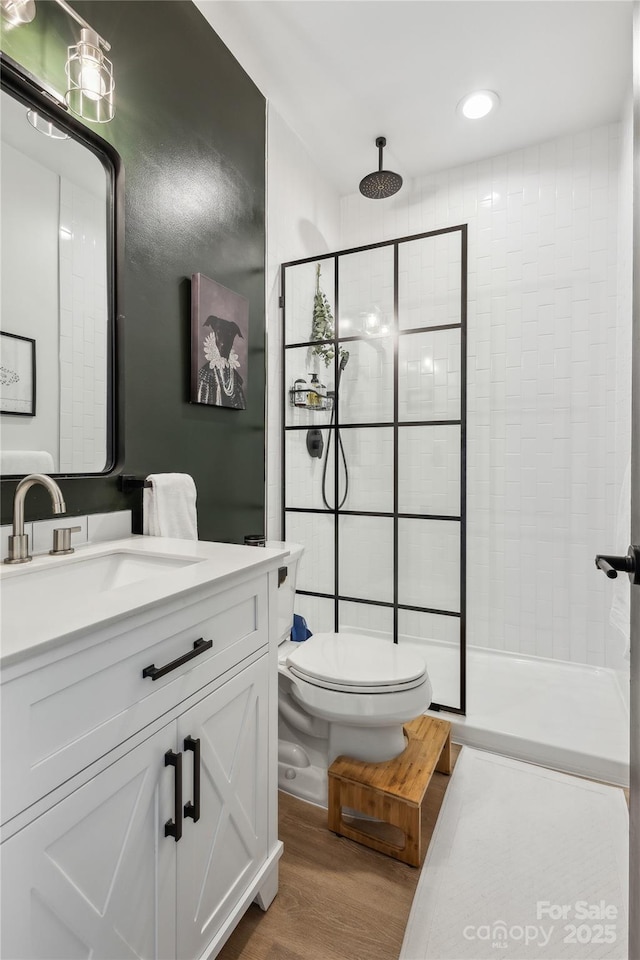 324 Elm St, Belmont, NC 28012 - full bath with toilet, tiled shower, wood finished floors, and vanity