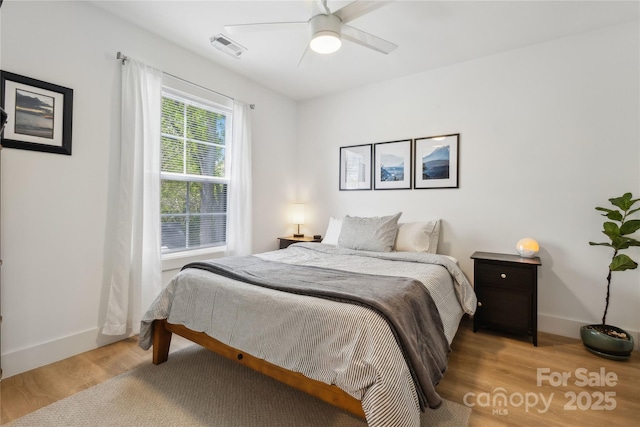 324 Elm St, Belmont, NC 28012 - bedroom with light wood-style flooring, baseboards, and ceiling fan