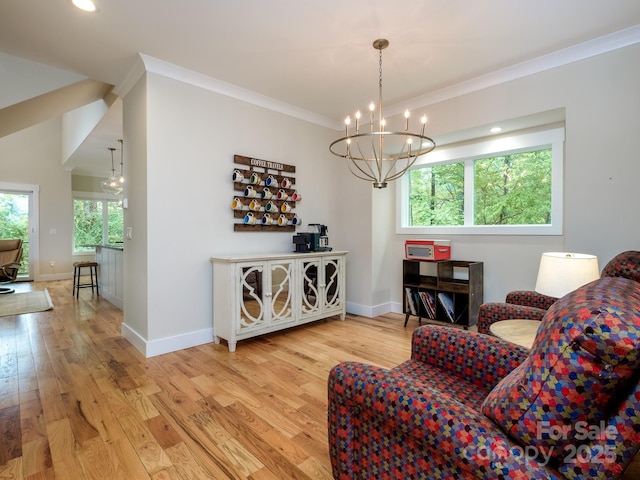 sitting room featuring a chandelier, wood finished floors, ornamental molding, baseboards, and recessed lighting