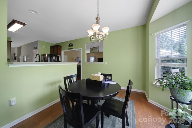 2017 White Cedar Ln, Waxhaw, NC 28173 - dining room with a chandelier, dark wood-style floors, and baseboards
